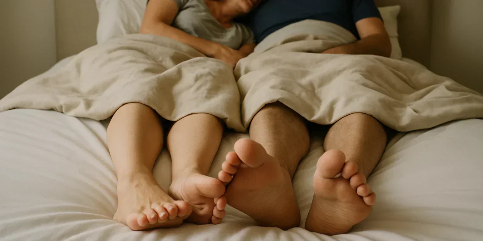 Couple in bed together after fixing sexual health problems