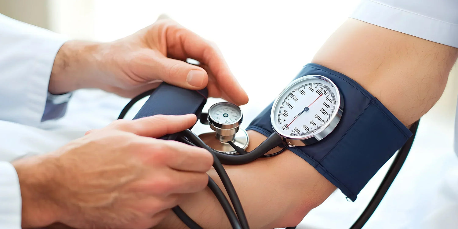 mans arm getting blood pressure checked