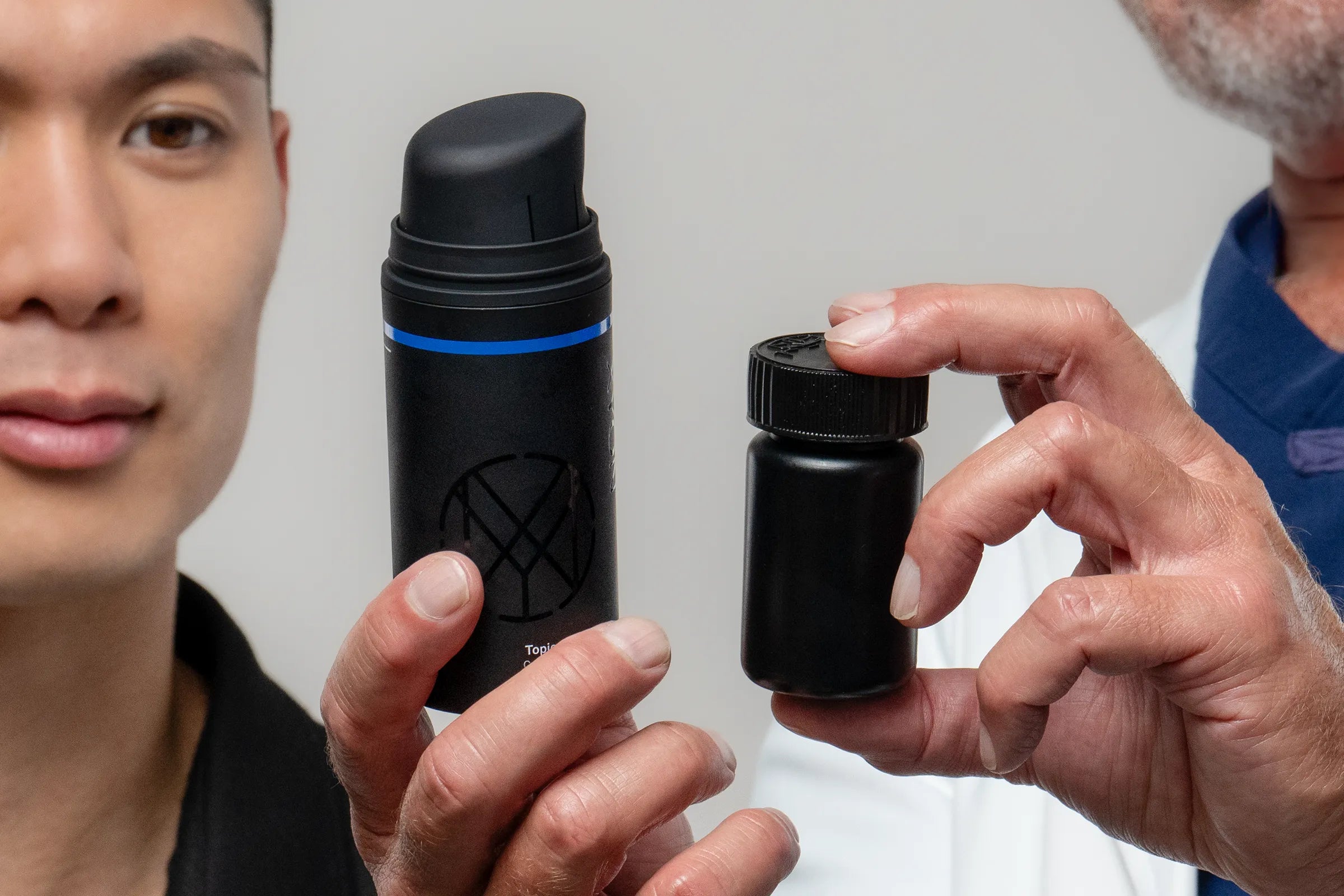 topical and pill based hair loss medication bottles