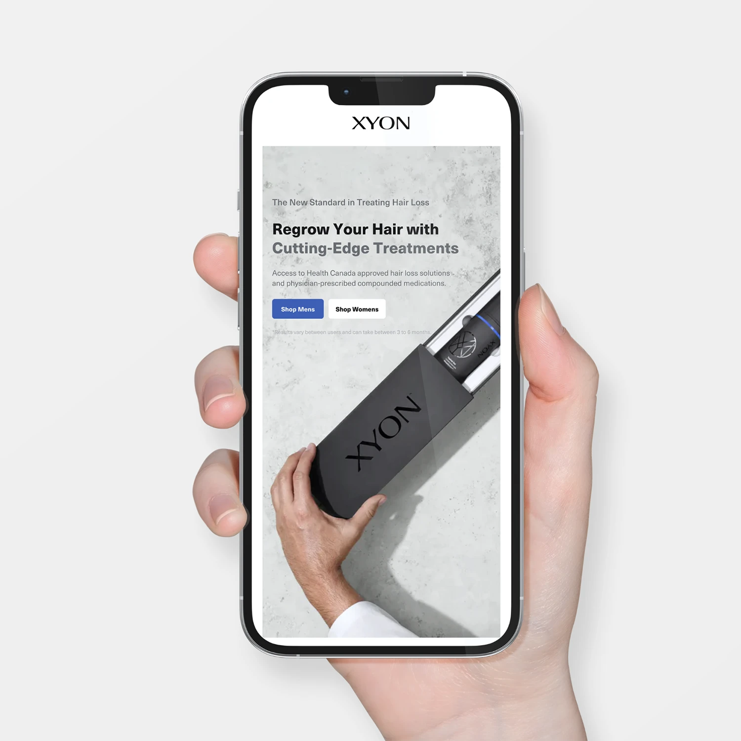 a hand holding up the xyon online platform on a mobile device