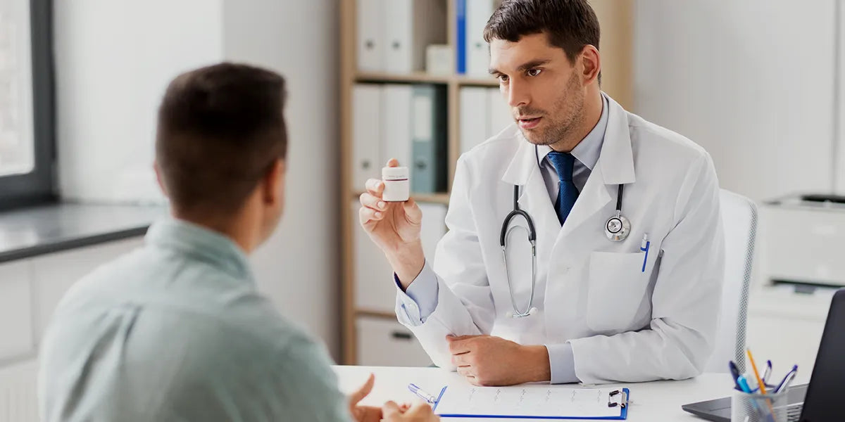 Doctor discussing options for best medication for hair loss with his patient.