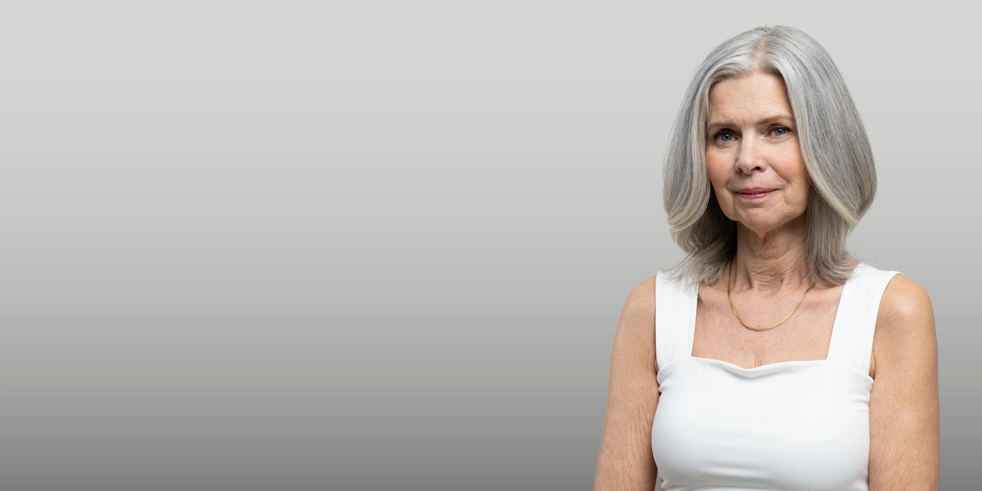 Older women with grey hair experiencing menopause hair loss.