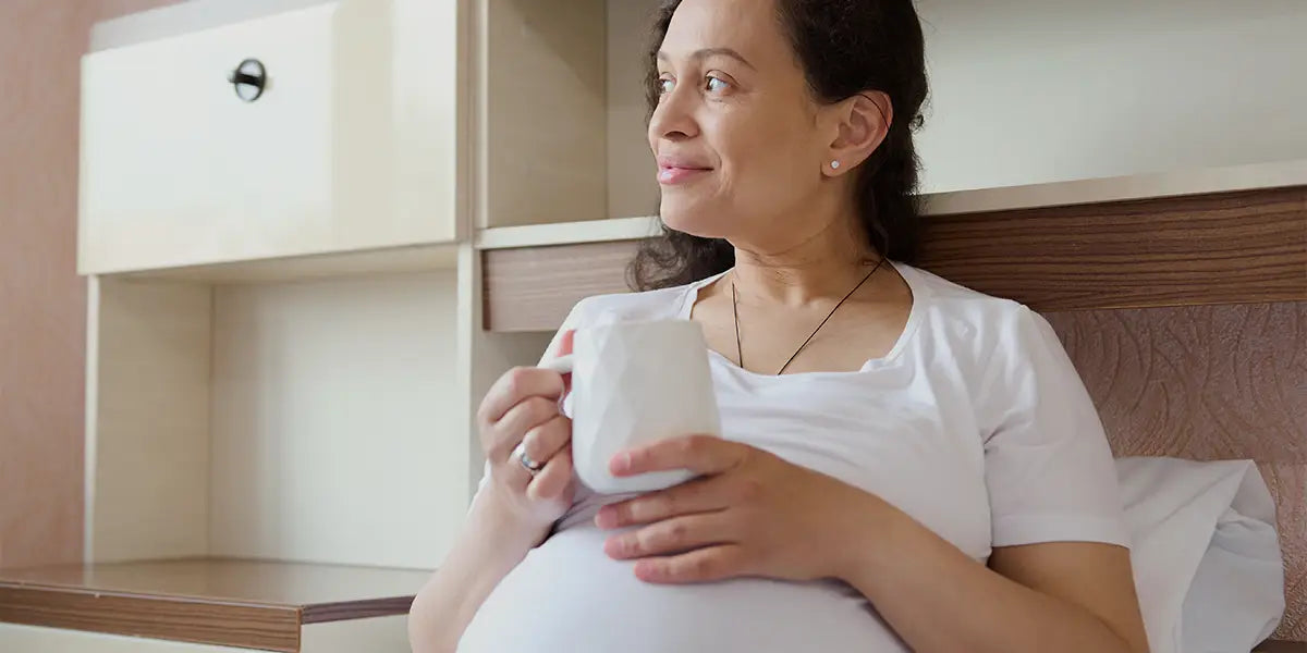 Woman contemplating pregnancy and hair loss.