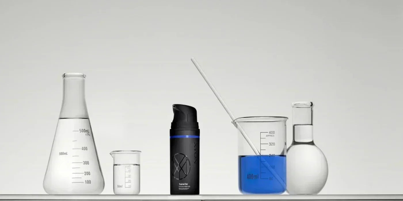 Image of 3 scientific beakers with clear liquids in them. 