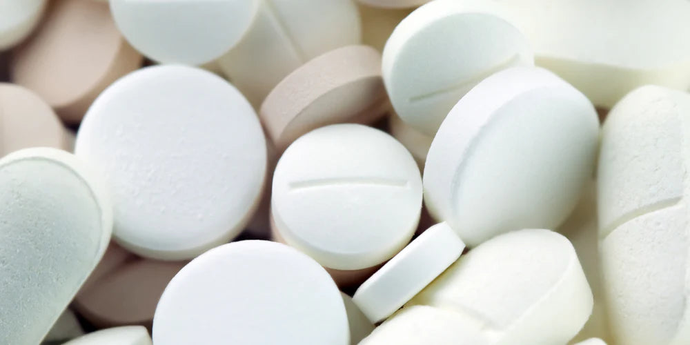 Image of lots of oral tablets. 